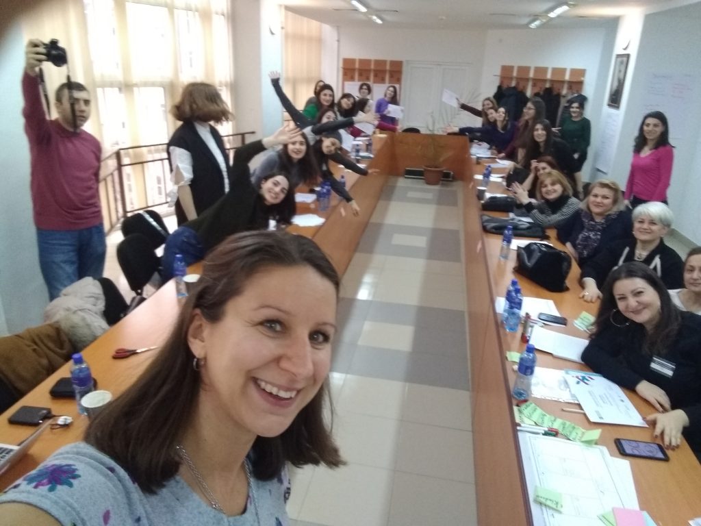 A group of women capturing a selfie during an entrepreneur support conference.