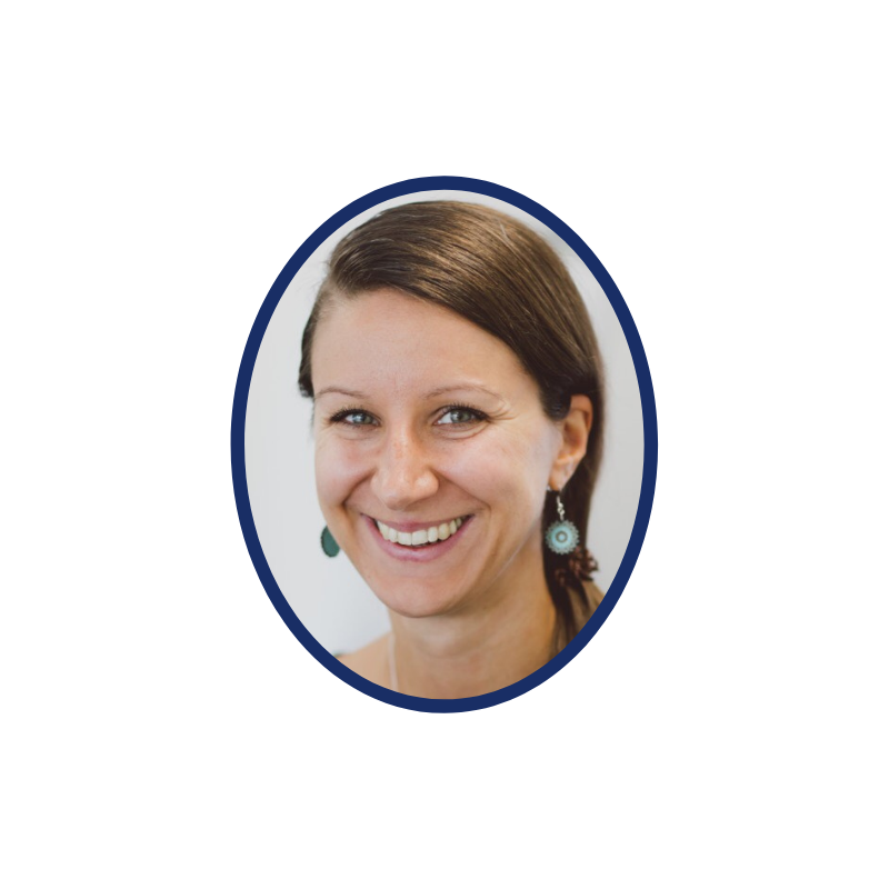 An image of a smiling woman with blue earrings demonstrating startup support.